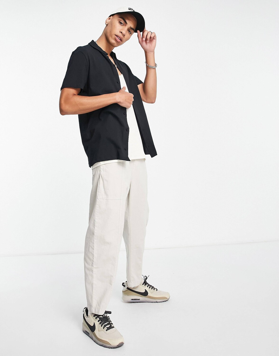 

Черная рубашка из джерси на пуговицах ASOS DESIGN