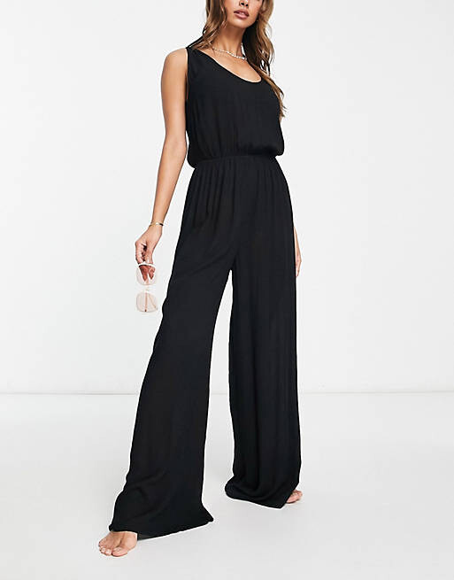 

Черный пляжный комбинезон минималистичного жатого широкого кроя ASOS DESIGN