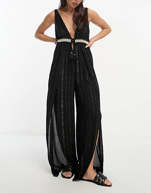 

Черный пляжный комбинезон с глубоким вырезом и широкими штанинами River Island