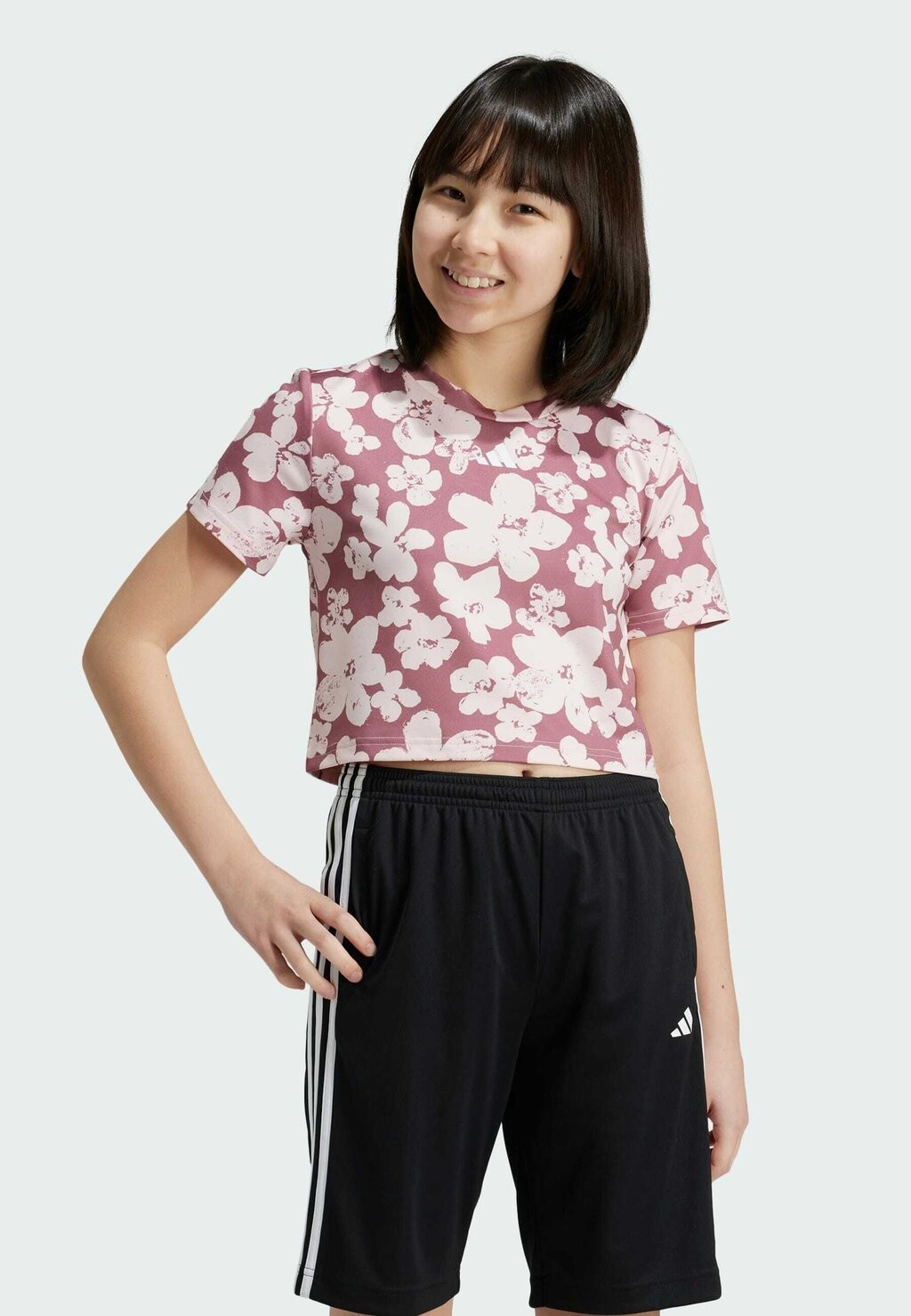

Спортивная футболка ESSENTIALS SEASONAL PRINTED CROPPED KIDS adidas, лиловый