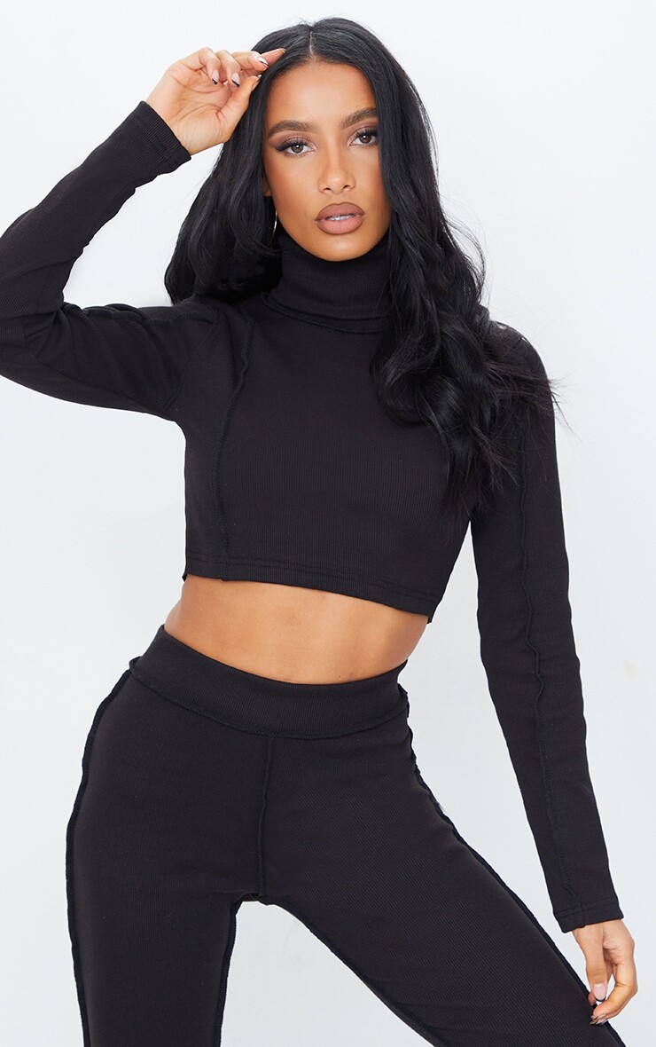 

PrettyLittleThing Черный укороченный топ с длинными рукавами и высоким воротником в рубчик, украшенный строчкой