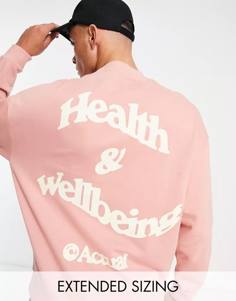 

Розовая толстовка оверсайз ASOS Actual с принтом в виде логотипа Health and Wellbeing сзади