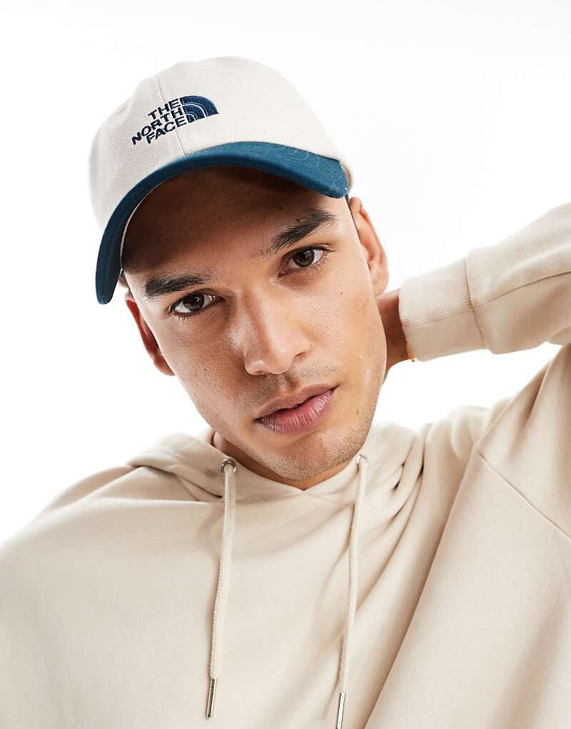 

Бело-синяя бейсболка с логотипом The North Face Norm
