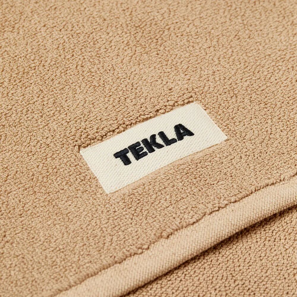 цена Tekla Fabrics Органический махровый коврик для ванной, оранжевый
