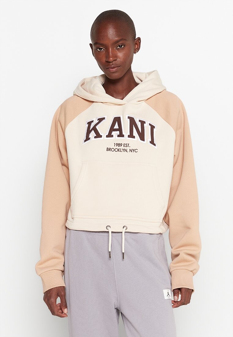 

Толстовка KK SERIF CROP RAGLAN HOODIE CREAM/SAND Karl Kani, молоко