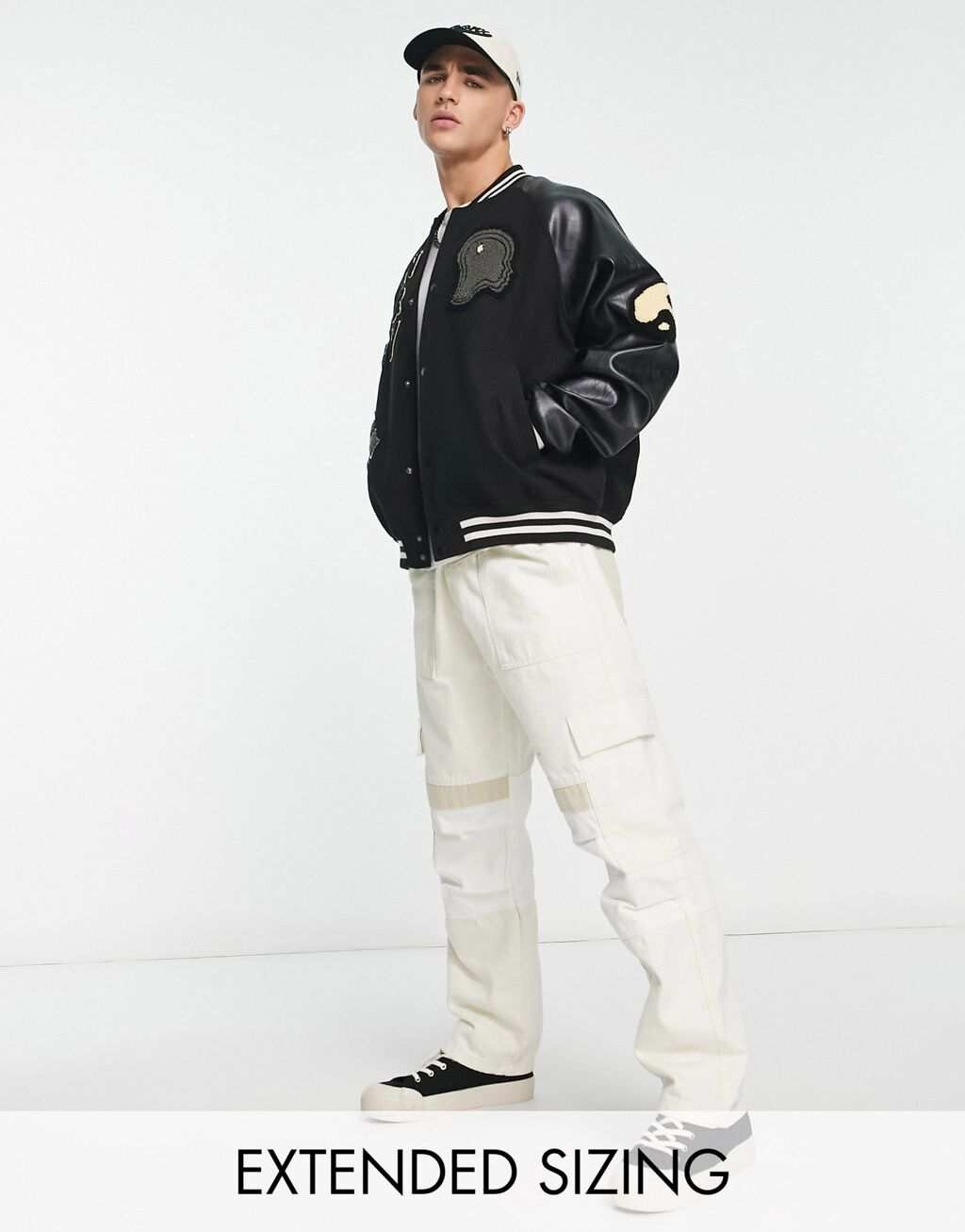 

Черная университетская куртка оверсайз с рукавами из искусственной кожи ASOS DESIGN, Черный
