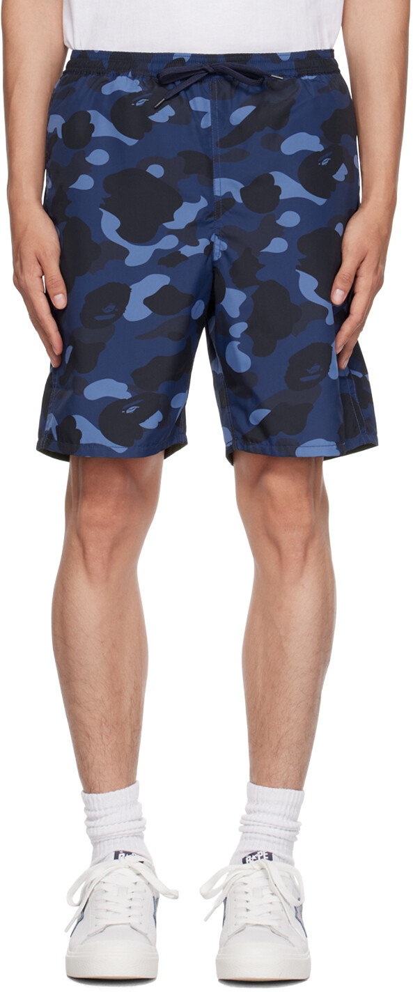 

Темно-синие двусторонние шорты BAPE с камуфляжным принтом и изображением акулы