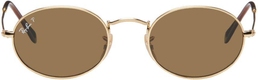 

Золотые овальные солнцезащитные очки Ray-Ban