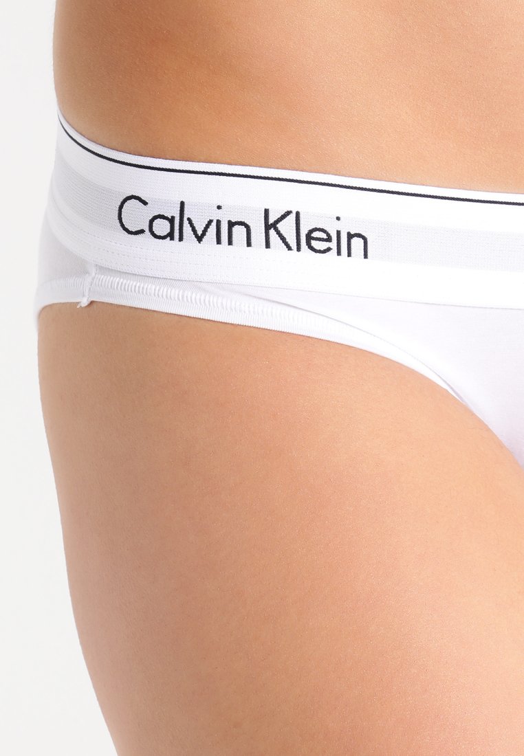 Стринги кельвин кляйн. Calvin Klein USA трусы. Calvin Klein трусы женские стринги прозрачные. Calvin Klein Элегант набор. Calvin Klein USA com.