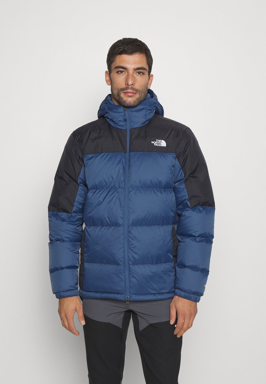 

Пуховик The North Face, темно-синий