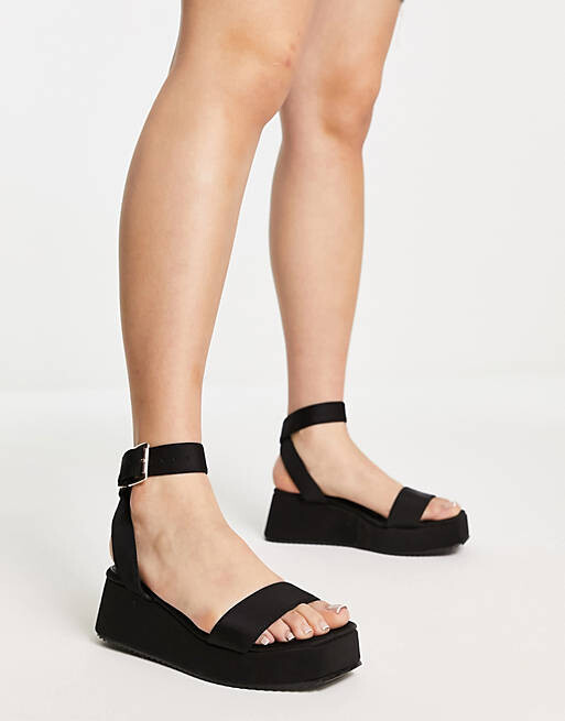 

Черные сандалии на плоской платформе ASOS DESIGN Wide Fit Tati