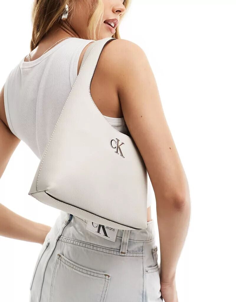 

Сумка через плечо Calvin Klein каменно-бежевого цвета с мелким узором монограммы