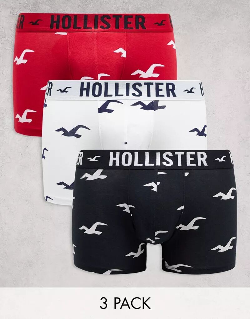 

Комплект из 3 трусов Hollister белого/красного/черного цвета с принтом логотипа по всей поверхности