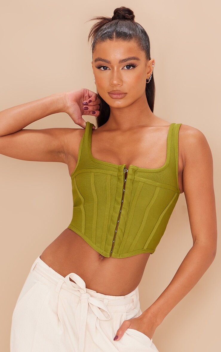 

PrettyLittleThing Оливковый корсет с глубоким вырезом на крючках и проушинами