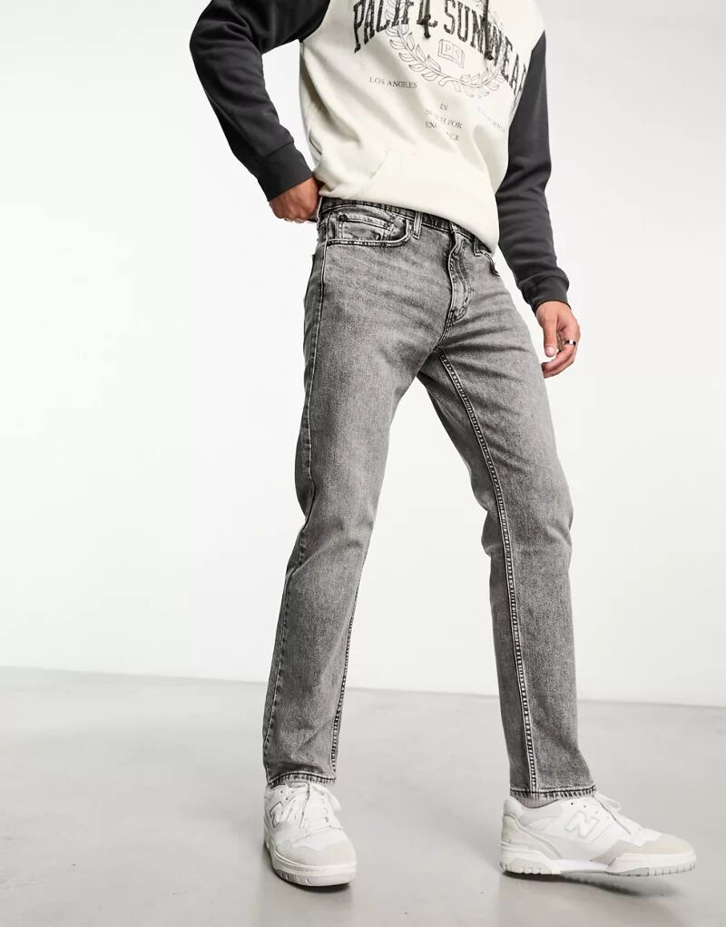 Светло-серые зауженные джинсы Levi's 502 цена и фото