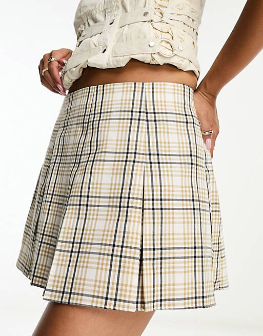 

Бежевая мини-юбка со складками ASOS DESIGN