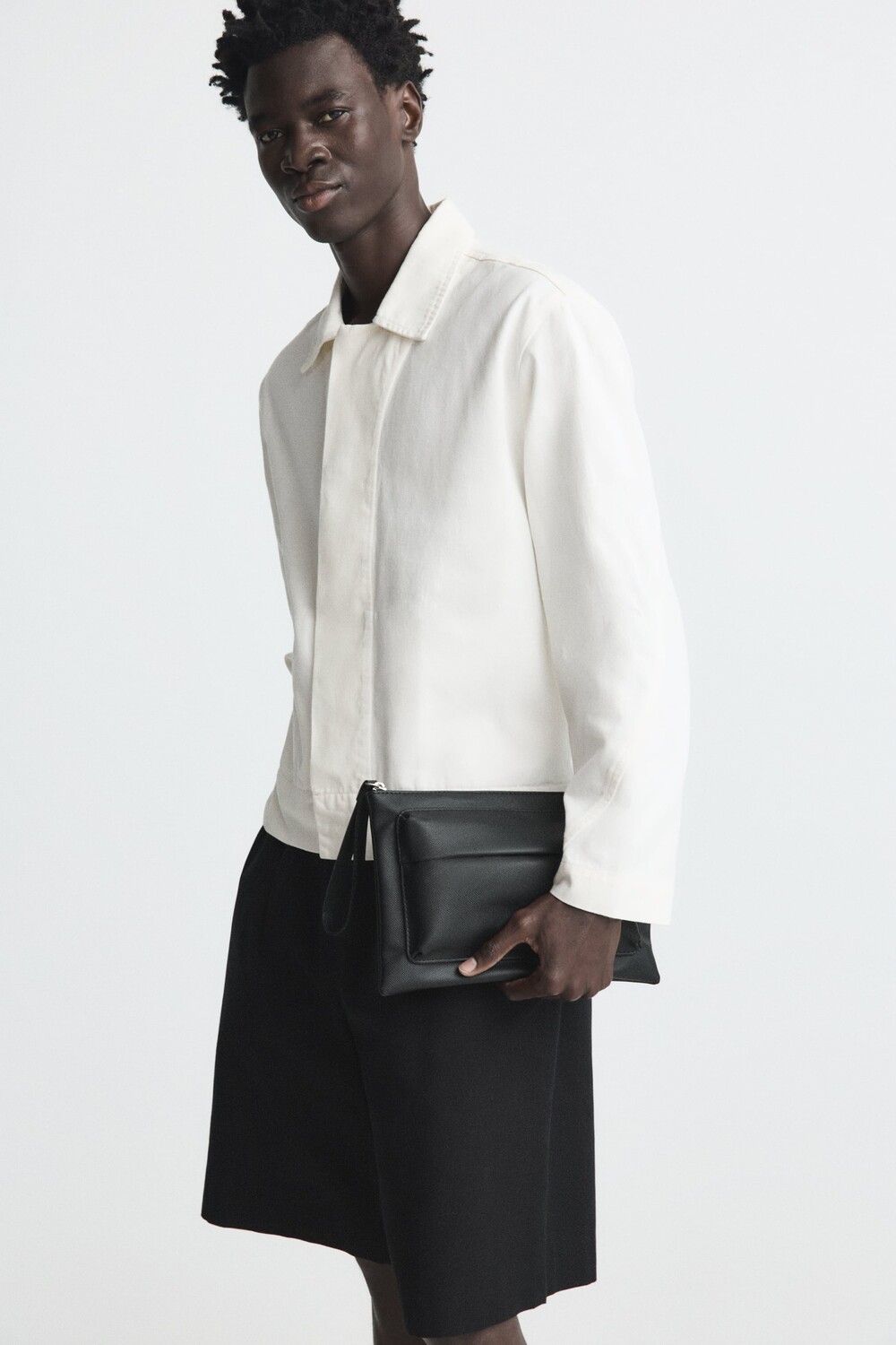 

Узкий клатч с резьбой Zara, черный