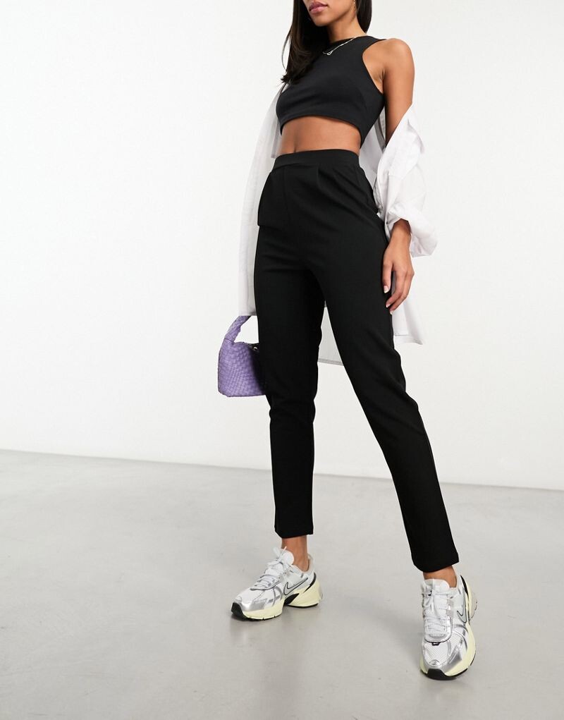 

Черные зауженные брюки из джерси ASOS DESIGN