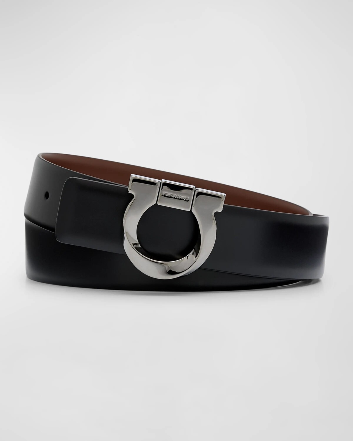

Мужской двусторонний кожаный ремень с пряжкой Gancio Ferragamo, цвет Nero Cocoa Brown