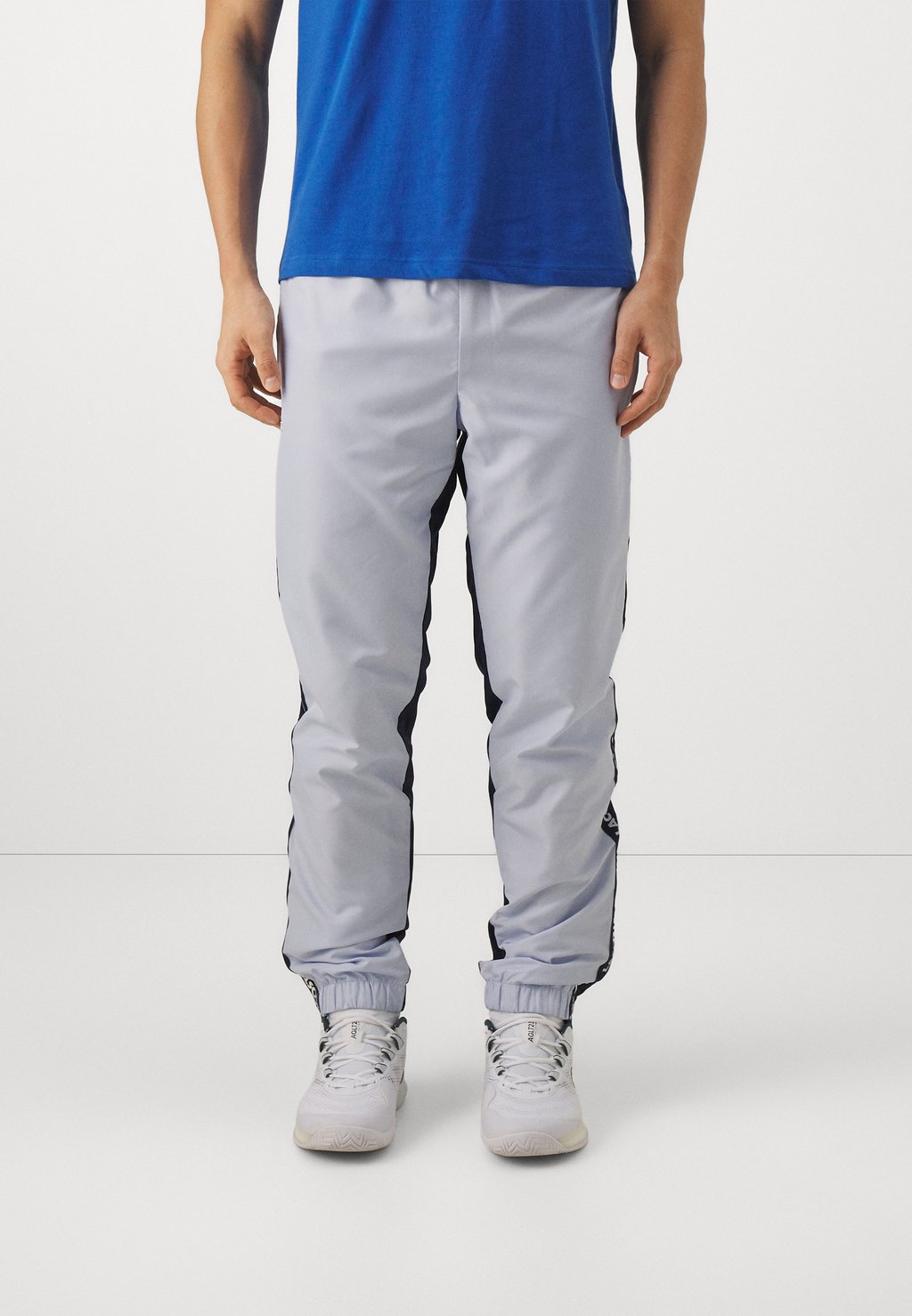 цена Спортивные брюки Trousers Tc Lacoste, цвет phoenix blue/navy blue