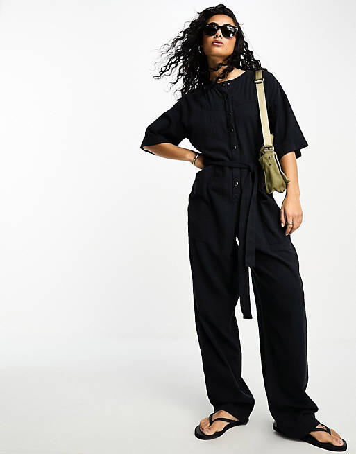 

Черный комбинезон с пуговицами спереди ASOS DESIGN