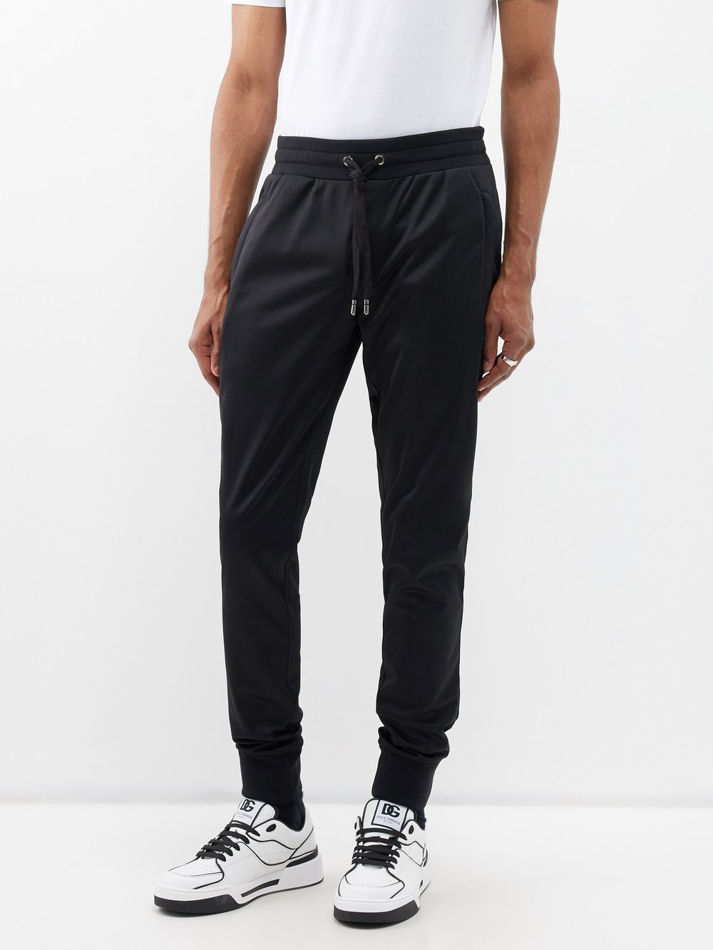 черные спортивные брюки с логотипом box dsquared2 черный Спортивные брюки из джерси с бляшкой-логотипом Dolce & Gabbana, черный