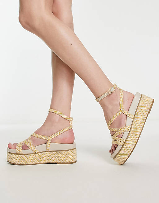 

Горчичные босоножки на плоской платформе с ремешками ASOS DESIGN Taurus