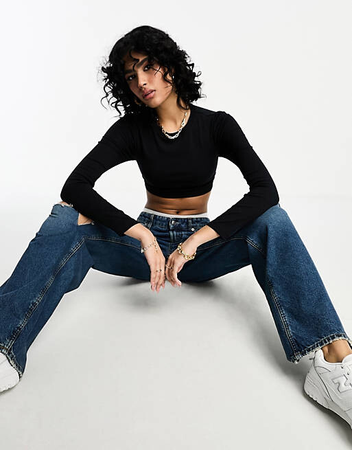 

Черный укороченный топ с длинными рукавами и завязкой на спине ASOS DESIGN