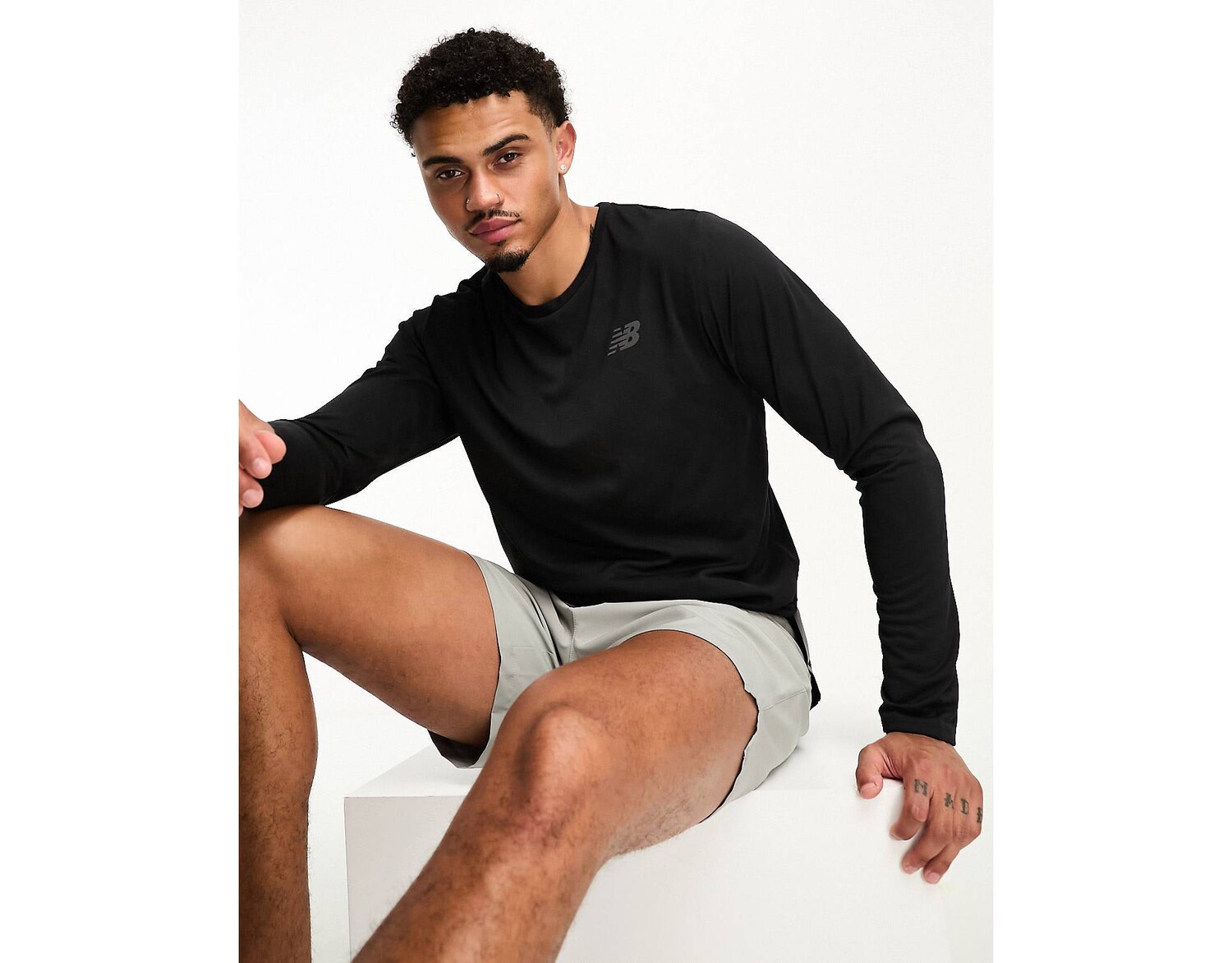 

Черный жаккардовый топ с длинными рукавами New Balance Q Speed