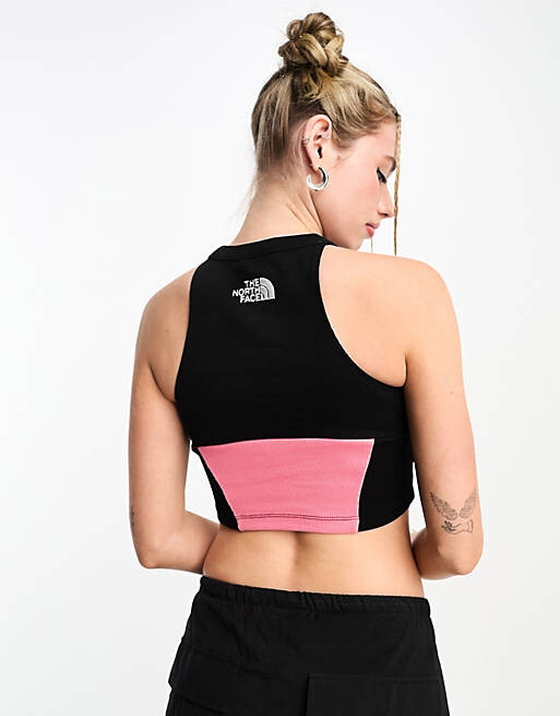 

Укороченная майка с логотипом The North Face center розового и черного цветов.