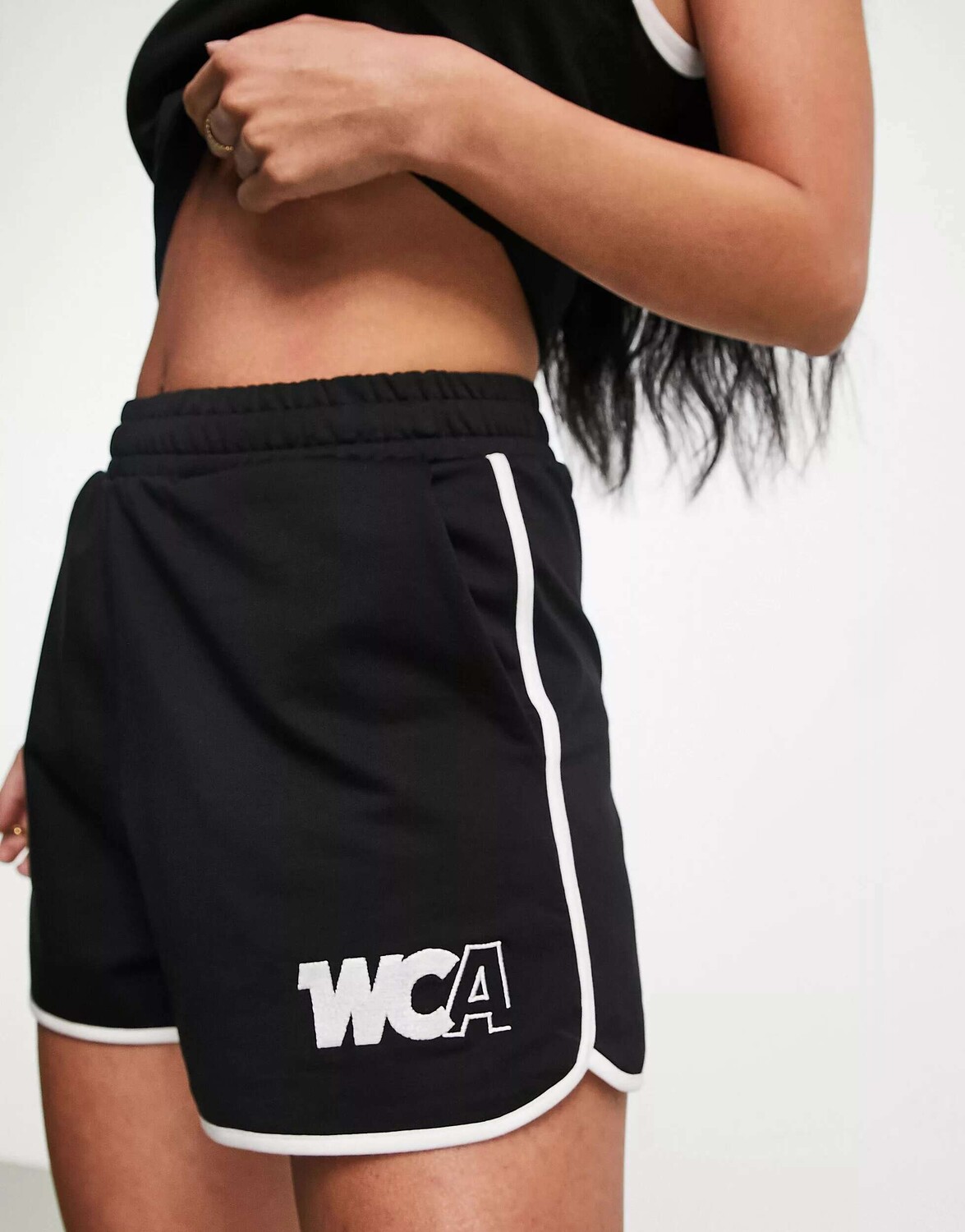 

Черные шорты для бега с кантом и логотипом WCA ASOS Weekend Collective
