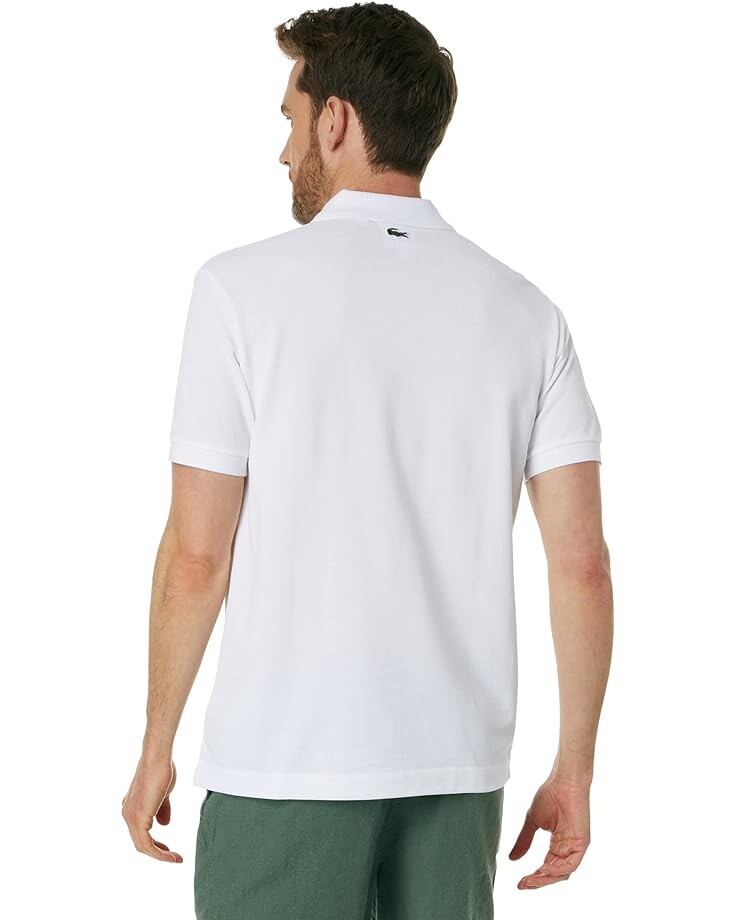 

Поло Lacoste Netflix Lupin Short Sleeve Classic Fit Polo Shirt, цвет White/Shadow/Bone