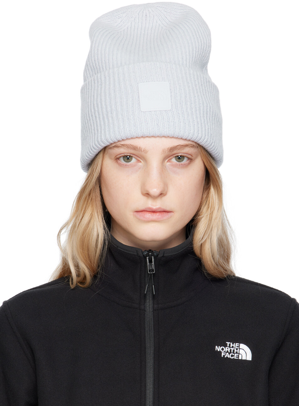 

Синяя шапка с нашивками Urban The North Face