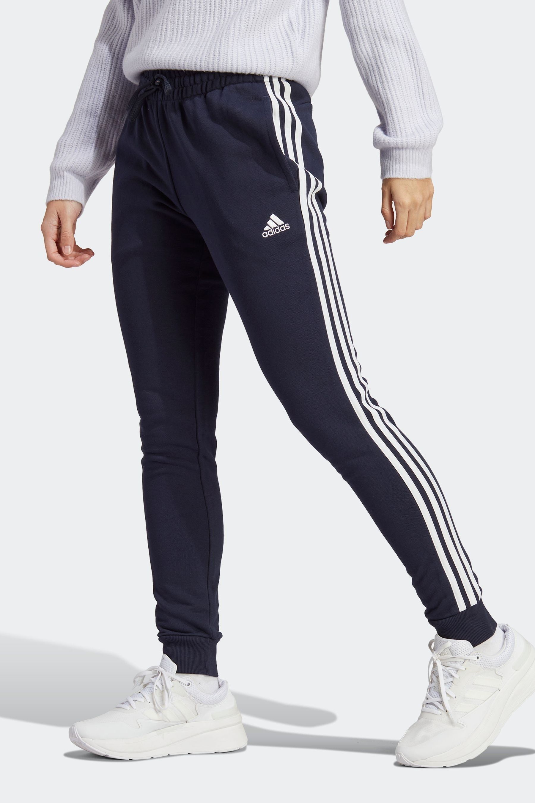 

Sportswear Essentials Терри джоггеры с тремя полосками и манжетами adidas, синий