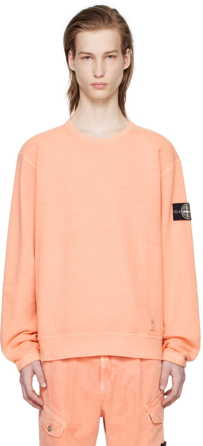

Розовый свитшот с нашивками Stone Island