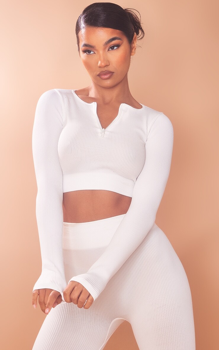 

PrettyLittleThing Белый структурированный укороченный топ на молнии с длинными рукавами в рубчик