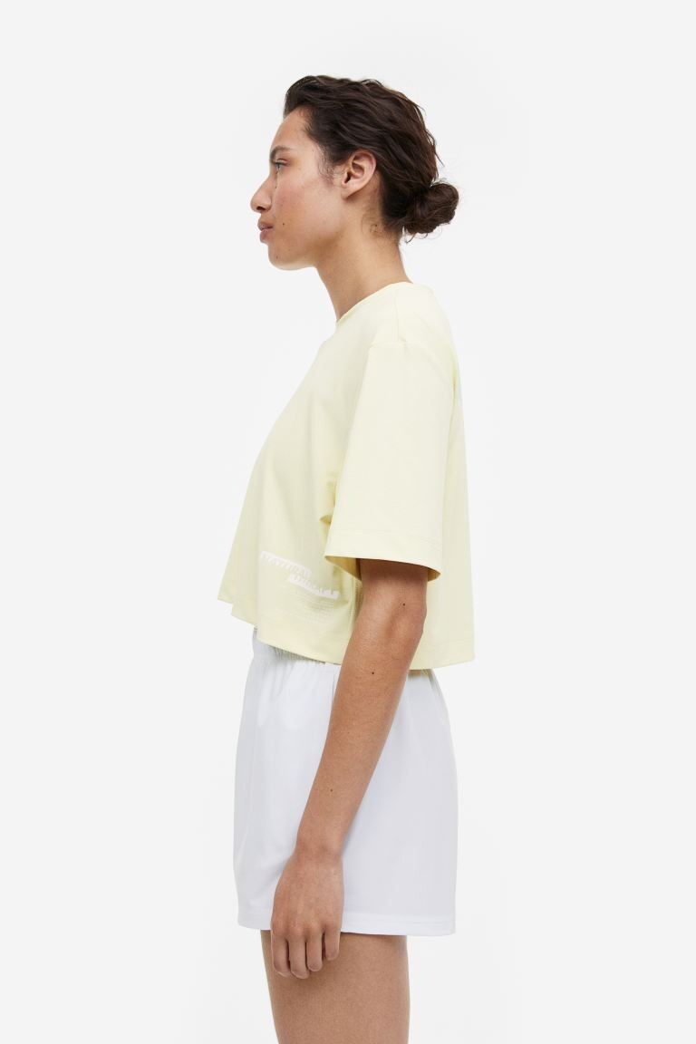 

Спортивный укороченный топ DryMove H&M
