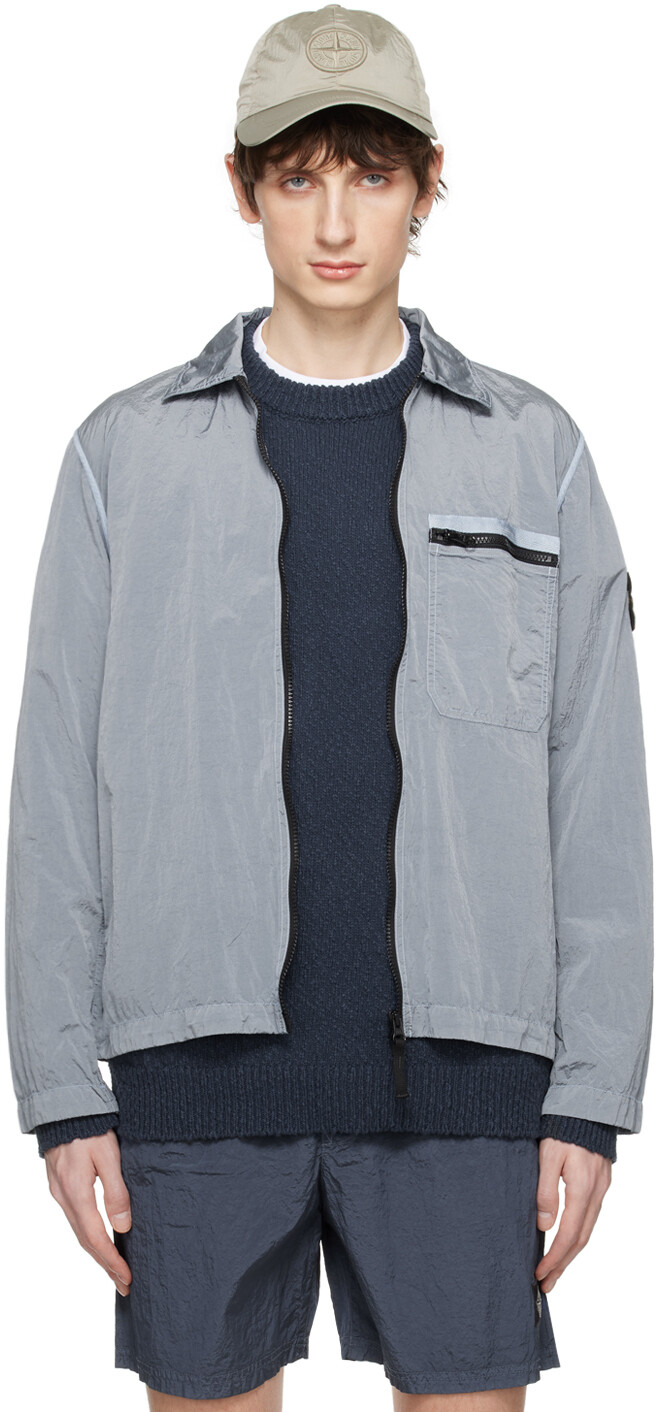 

Синяя куртка с нашивками Stone Island