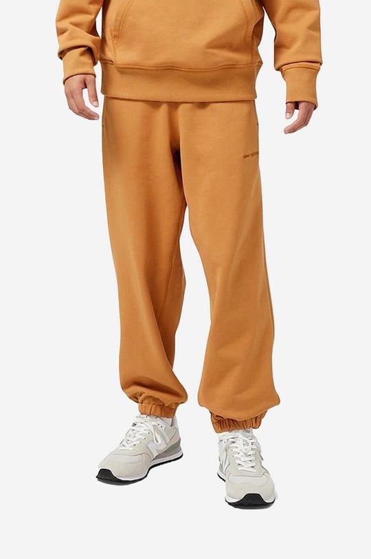 Хлопковые спортивные брюки New Balance, оранжевый