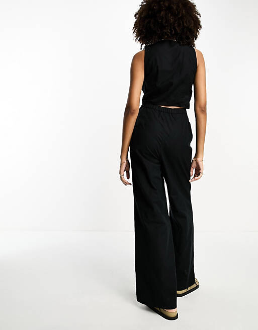 

Черный льняной комбинезон с пуговицами ASOS DESIGN