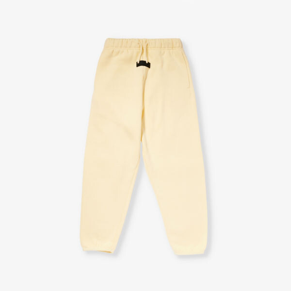 

Спортивные брюки свободного кроя из смесового хлопка с фирменной нашивкой для 4–16 лет Fear Of God Essentials, желтый