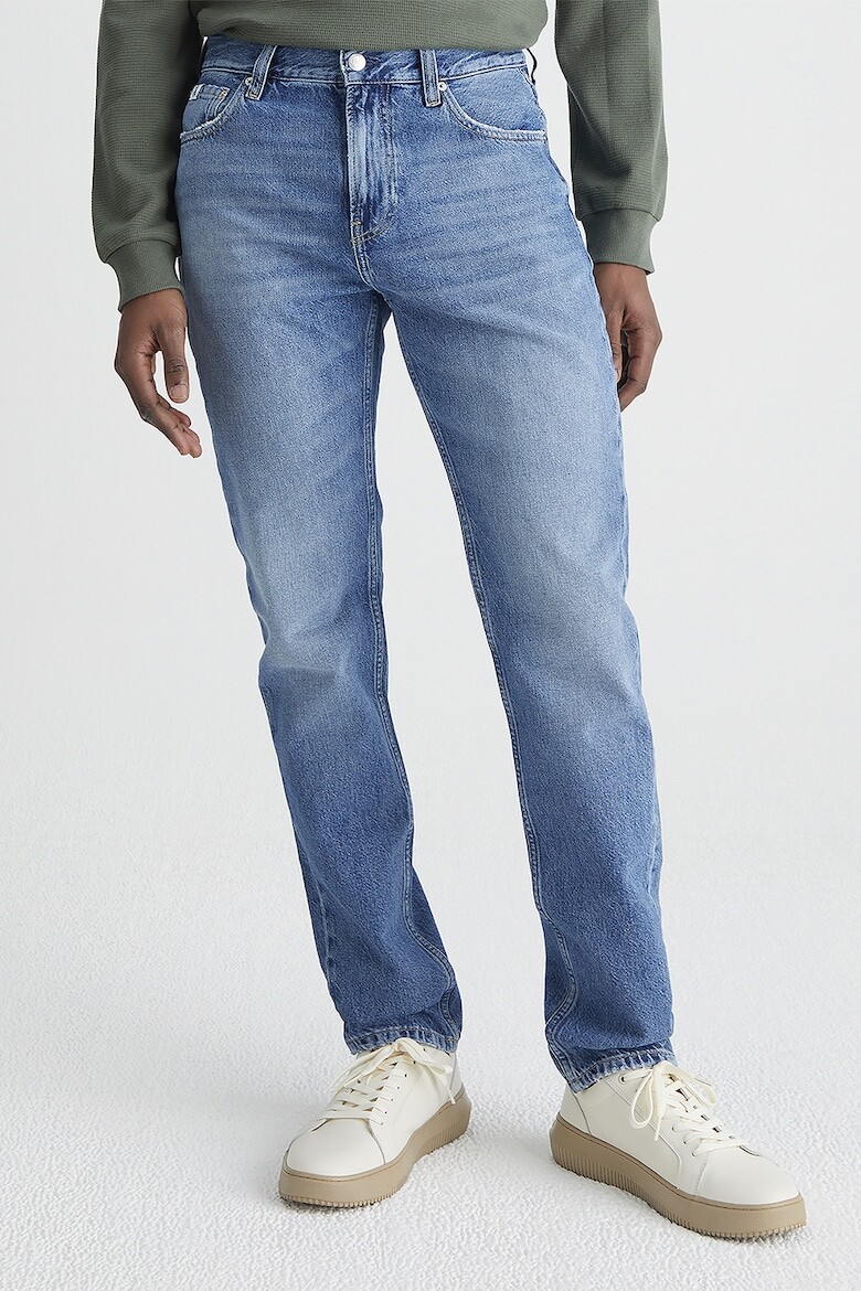 

Расклешенные джинсы с потертым эффектом Calvin Klein Jeans, синий