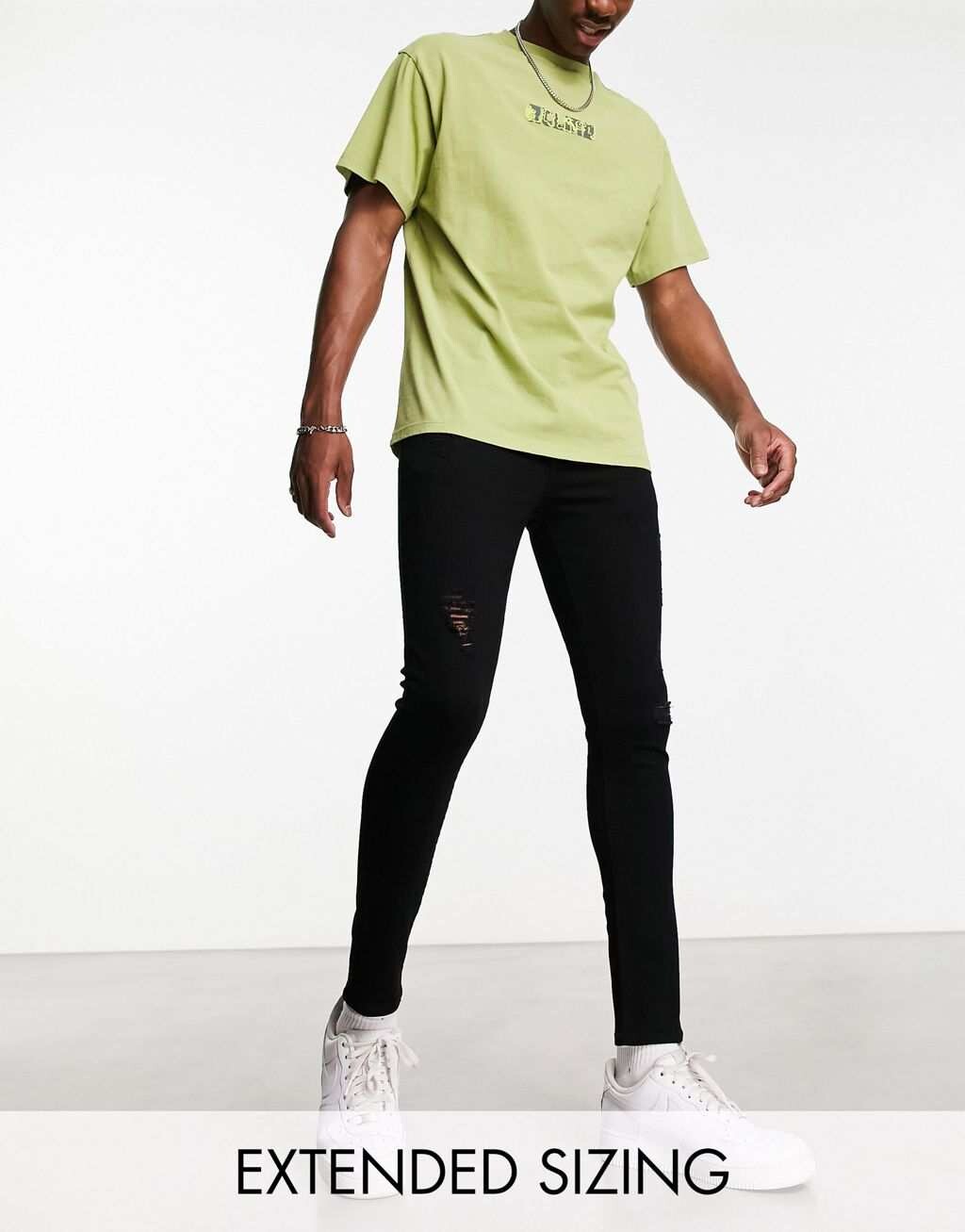 

Черные джинсы из эластичного денима с рваными краями ASOS DESIGN