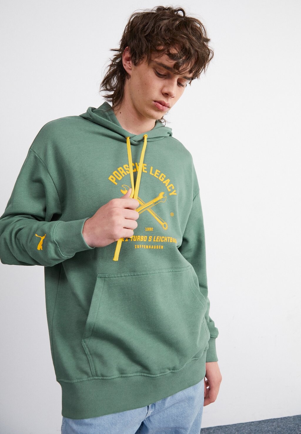 

Толстовка PUMA X PORSCHE GARAGE CREW HOODIE Puma, эвкалипт