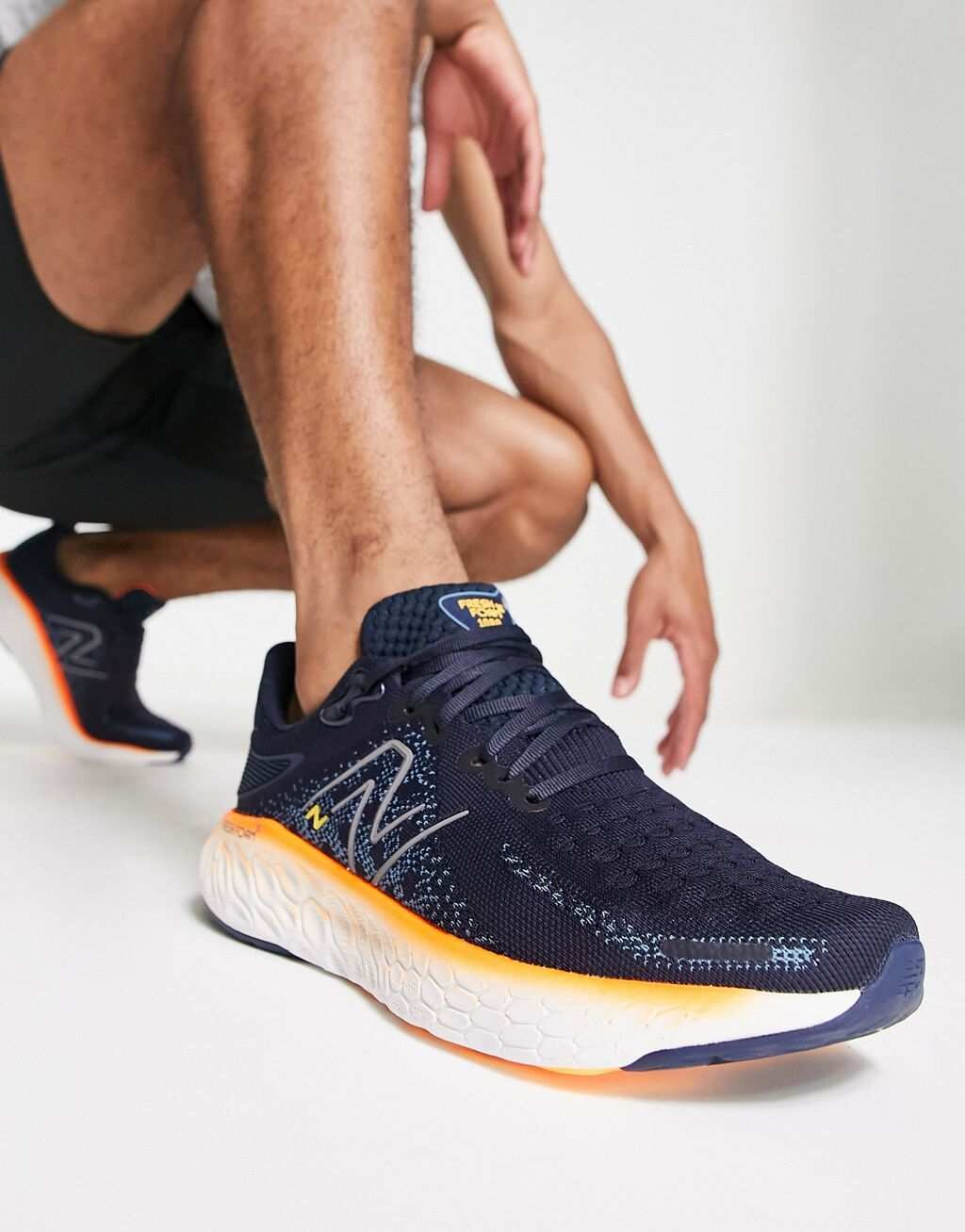 

Темно-синие и оранжевые кроссовки New Balance Running Fresh Foam X 1080v12