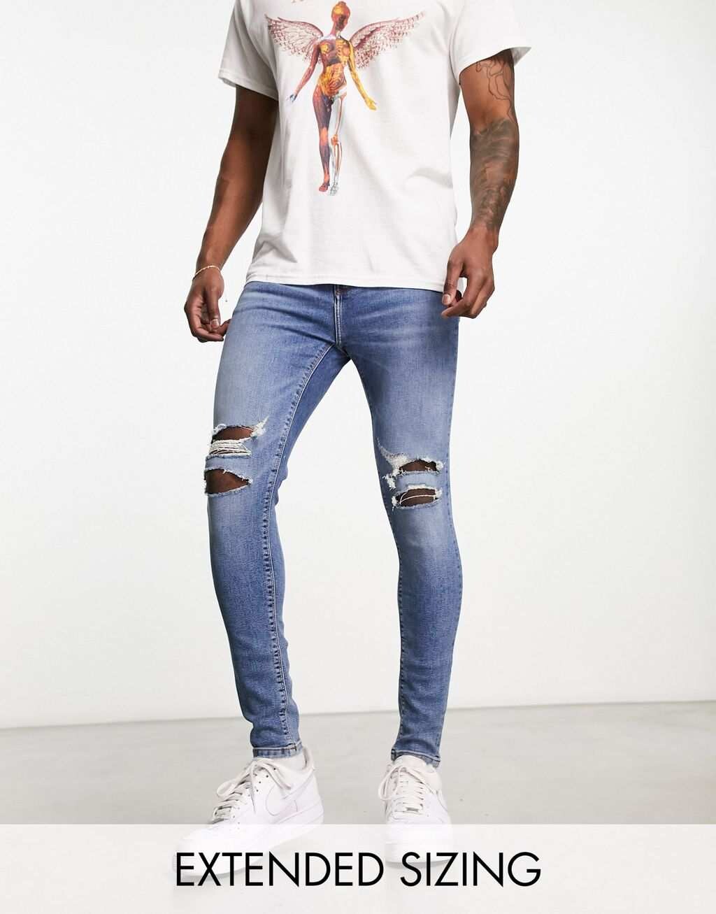 

Синие эластичные джинсы с эффектом спрея ASOS DESIGN