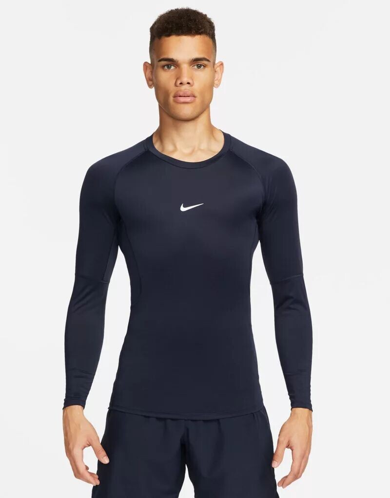 

Темно-синяя футболка узкого кроя с длинными рукавами Nike Pro