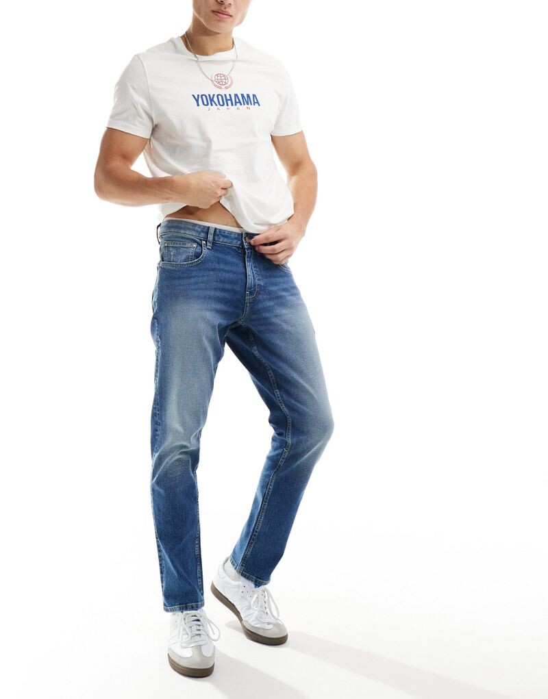 

Синие эластичные джинсы средней степени стирки ASOS DESIGN