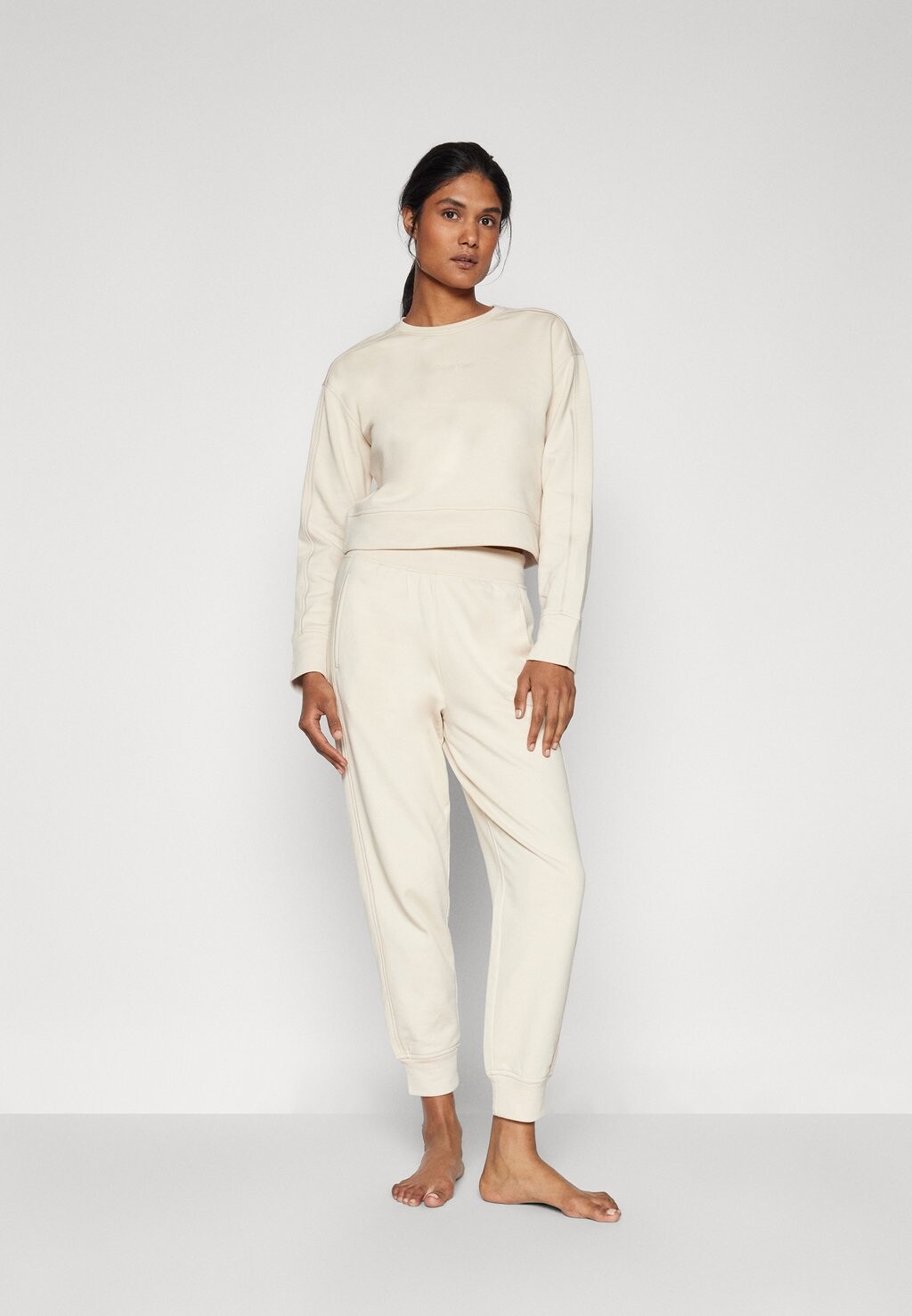 

Пижамные штаны FRENCH TERRY LOGOPANTS Calvin Klein, цвет Sandshell
