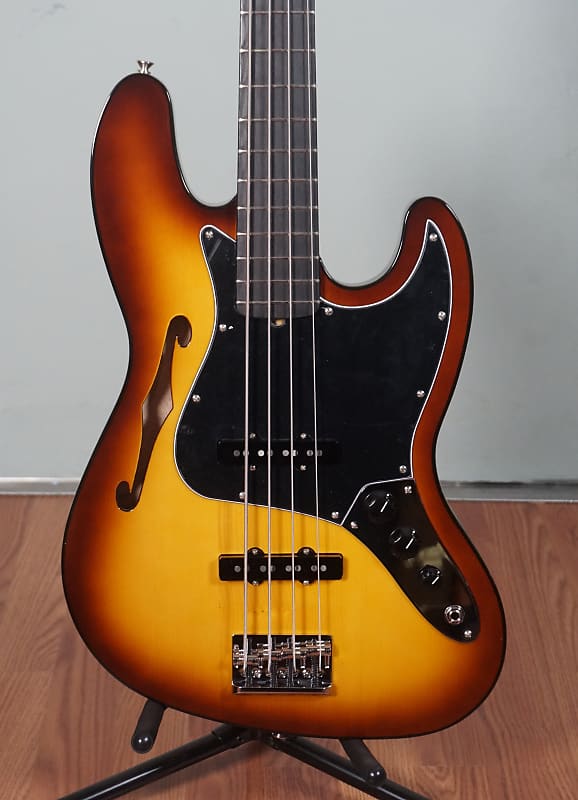 

Басс гитара Fender Limited Edition Suona Jazz Bass Thinline, Ebony Fingerboard, Violin Burst w/ Deluxe Blonde HSC